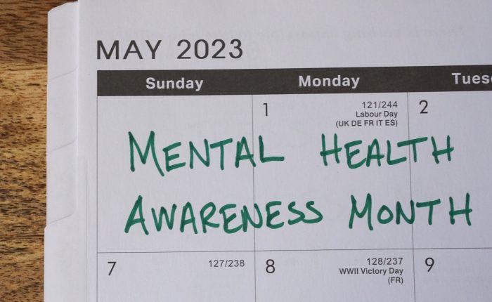 Mental Health Awareness month marked on a May 2023 calendar. Men