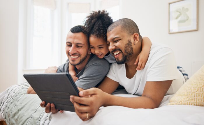 Child,,Gay,Family,And,Tablet,On,Bed,At,Home,For